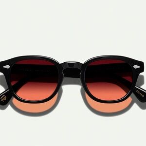 Used Moscot Lemtosh Sunglasses. Black frame Burgundy lens